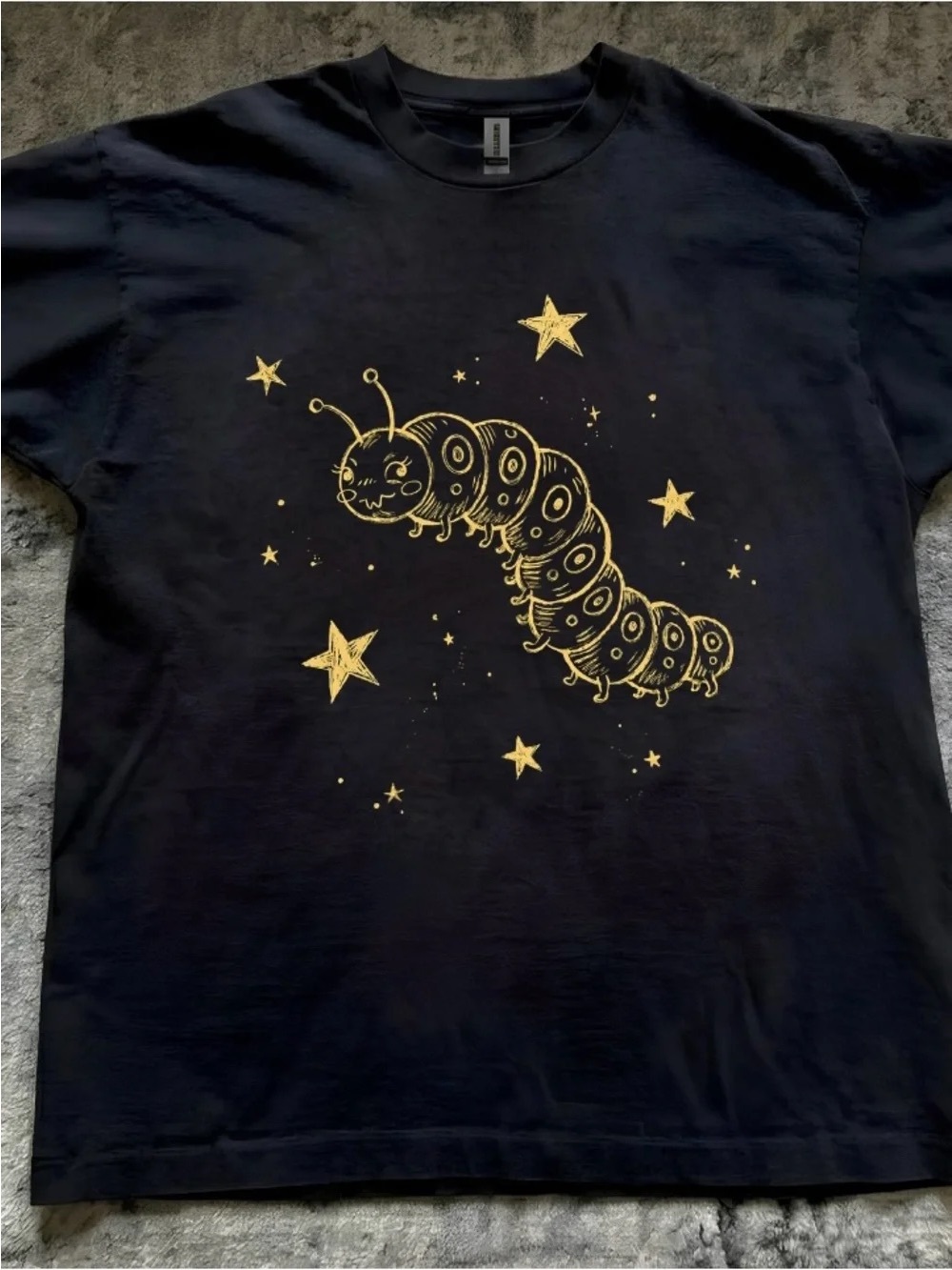 Black T‑Shirt with Gold Grub Star Graphic